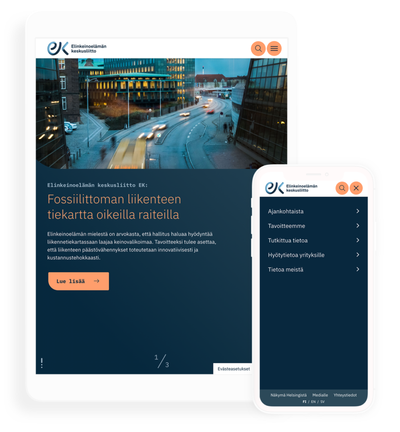 Tablet- ja älypuhelinmockup, jossa Elinkeinoelämän keskusliiton responsiivinen verkkosivu: iltakuva kaupunkikadusta liikennevaloilla ja hämyisillä ajovaloilla, tumma sininen sisältöalue otsikolla "Fossiilittoman liikenteen tiekartta oikeilla raiteilla" ja "Lue lisää" -painike, puhelinnäytöllä avoin valikko.