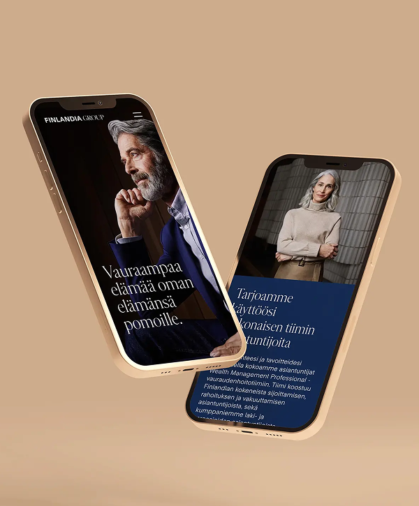 Mockup of two floating smartphones on a warm beige background showing the Finlandia Group mobile site: the left screen features a portrait of a bearded older man in a suit with a Finnish headline, the right screen shows a portrait of an older woman in a light sweater with supporting Finnish text and a navy accent band.