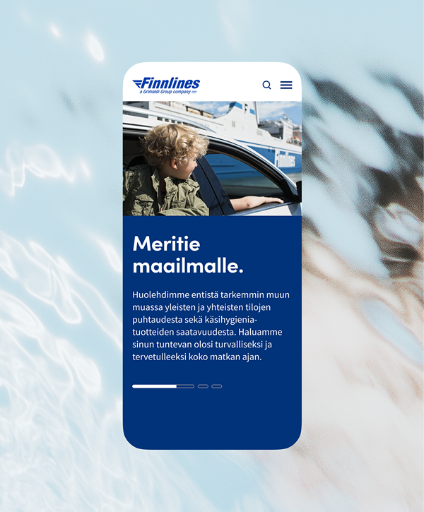 Smartphone mockup of Finnlines mobile site: top logo and menu, photo of a child looking out from a car at a docked ferry, and a blue information panel with the Finnish headline "Meritie maalle." about sea travel and safety.