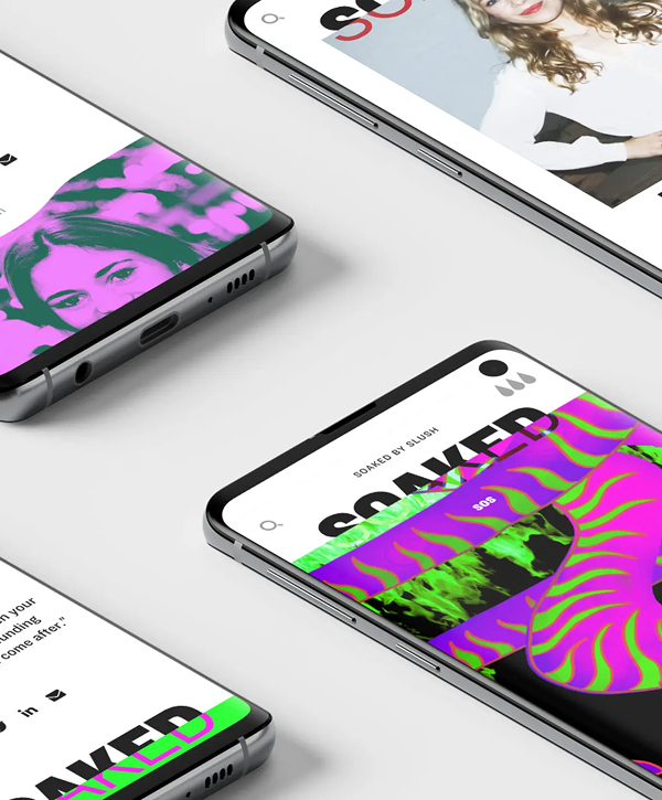 Overhead view of several smartphones angled on a white surface displaying a promotional layout for "SOAKED by Slush" with bold black lettering, neon pink and green psychedelic patterns and a woman's portrait across the screens.